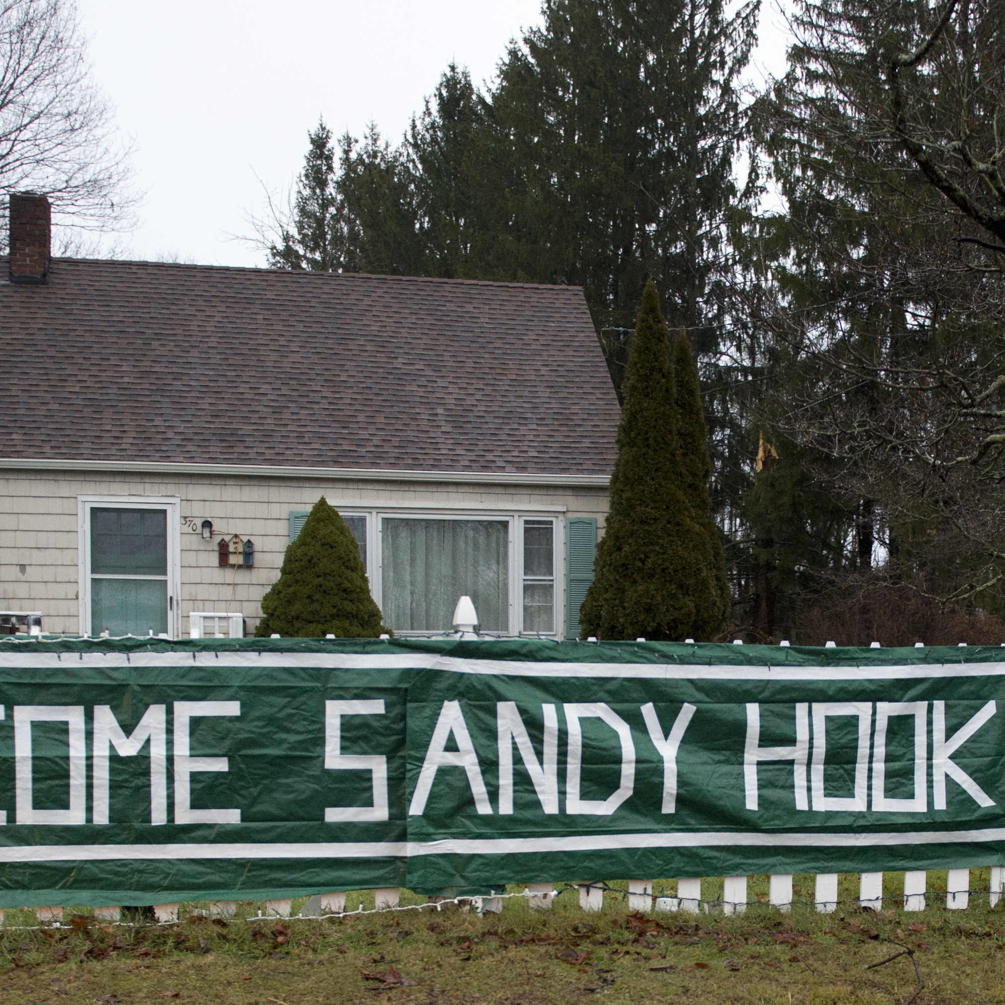 A sign near Chalk Hill Middle School greets students from Sandy Hook in Monroe, Conn. The students will start taking classes at the currently unused Chalk Hill school in January.