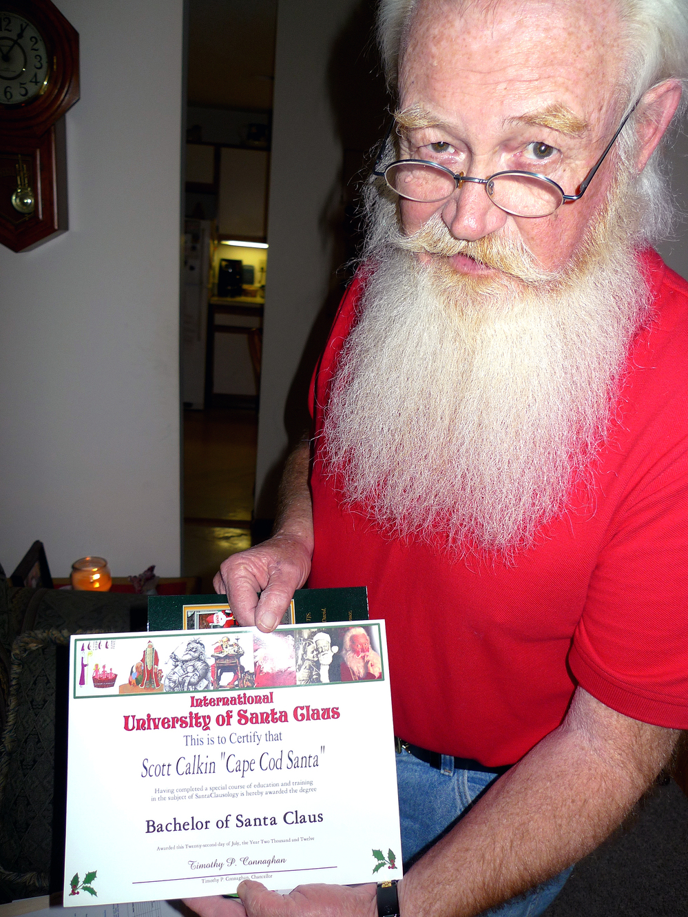 Scott Calkin, aka Cape Cod Santa, shows his diploma from the International University of Santa Claus. Scott Calkin, aka Cape Cod Santa, shows his diploma from the International University of Santa Claus.