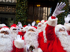 Charity workers dressed as Santa Claus wave to pedestrians in New York. Professional Santas say it's not an easy job, and it's not just as simple as putting on a beard. Charity workers dressed as Santa Claus wave to pedestrians in New York. Professional Santas say it's not an easy job, and it's not just as simple as putting on a beard.