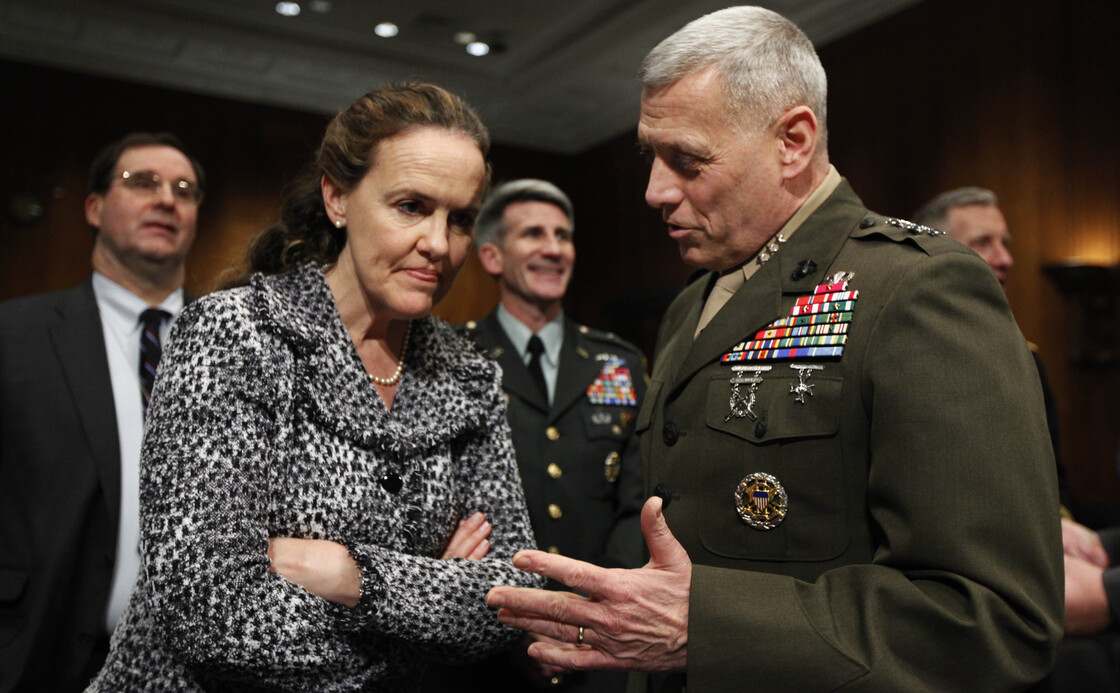 Defense Undersecretary for Policy Michele Flournoy talks with Marines Lt. Gen. John Paxton on Capitol Hill in 2010. Flournoy has since left her position to spend more time with her three children.