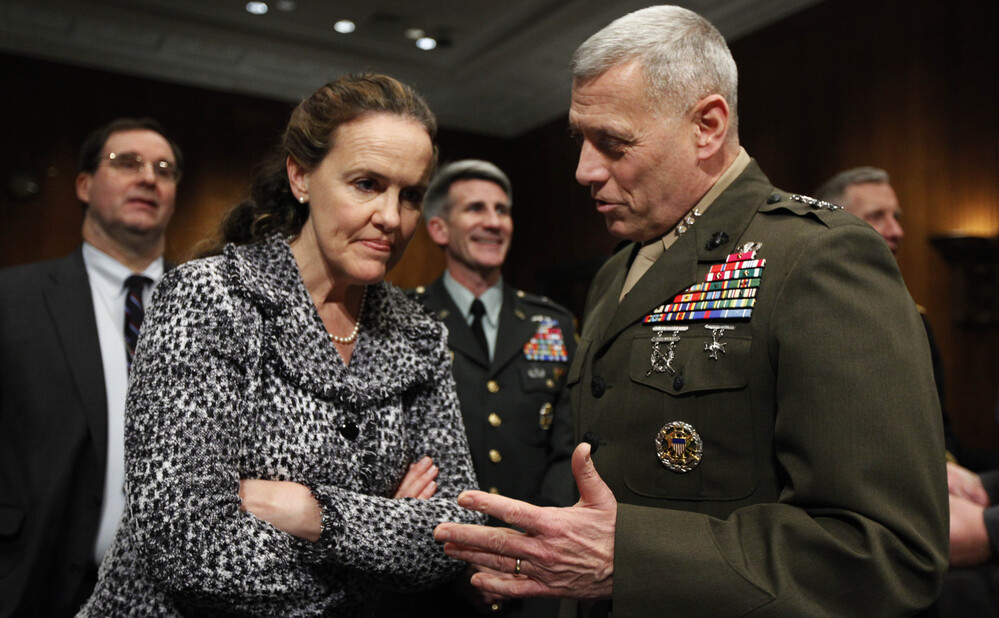 Defense Undersecretary for Policy Michele Flournoy talks with Marines Lt. Gen. John Paxton on Capitol Hill in 2010. Flournoy has since left her position to spend more time with her three children.