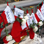 Christmas stockings with the names of shooting victims hang from a railing in the Sandy Hook village of Newtown, Conn. Christmas stockings with the names of shooting victims hang from a railing in the Sandy Hook village of Newtown, Conn.