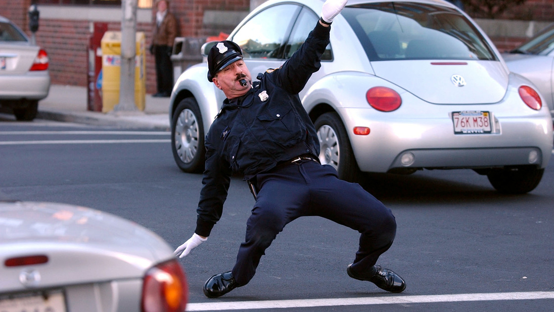 Retired police officer Tony Lepore performs his dance routine while directing traffic in 2004 in downtown Providence, R.I.