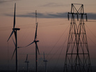 Wind turbines stand alongside an electrical tower at the National Wind Technology Center, run by the U.S. Department of Energy, outside Boulder, Colo. Wind turbines stand alongside an electrical tower at the National Wind Technology Center, run by the U.S. Department of Energy, outside Boulder, Colo.