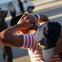 Employees with the U.S. Immigration and Customs Enforcement agency search Guatemalan immigrants before they are put aboard a deportation flight to Guatemala City on June 24, 2011, in Mesa, Ariz.