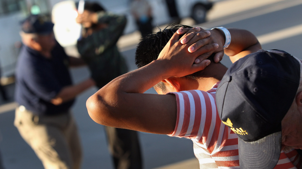 Employees with the U.S. Immigration and Customs Enforcement agency search Guatemalan immigrants before they are put aboard a deportation flight to Guatemala City on June 24, 2011, in Mesa, Ariz. Employees with the U.S. Immigration and Customs Enforcement agency search Guatemalan immigrants before they are put aboard a deportation flight to Guatemala City on June 24, 2011, in Mesa, Ariz.