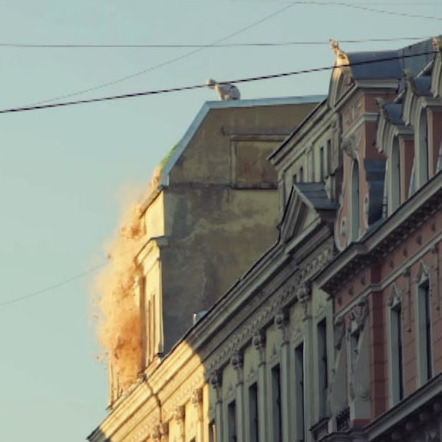 An enormous sack cattail seeds was carried to a rooftop in downtown Riga, Latvia and  dumped onto busy streets below.
