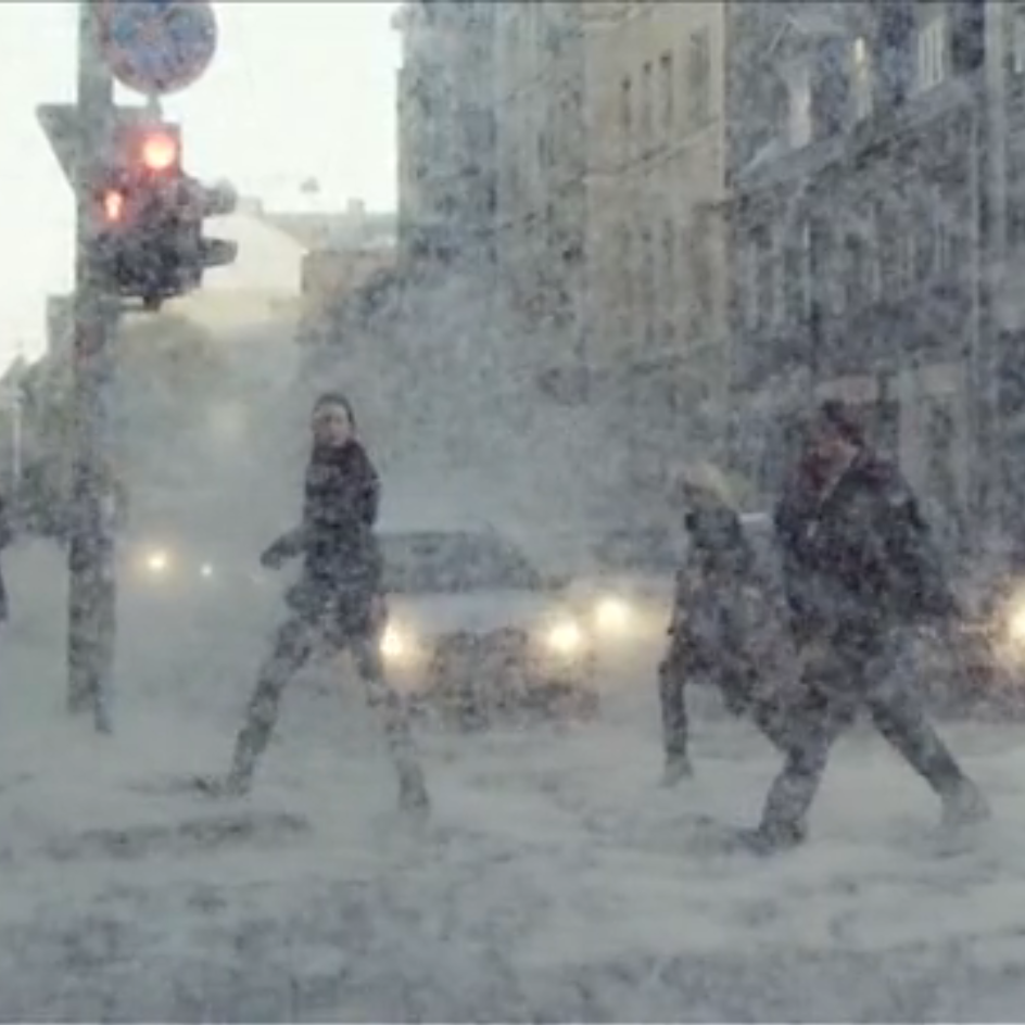 Pollen-producing cattail seeds were dumped onto busy downtown Riga, creating a spectacle of imaginative snowy wonderland.