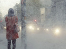 A woman standing in what looks like snow. A woman standing in what looks like snow.