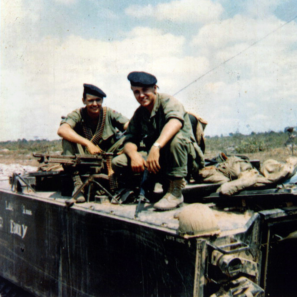 Chuck Hagel, right, and his younger brother Tom sit atop an armored personnel carrier in Vietnam, in a photo taken in or around 1968. The Hagel brothers were squad leaders with the U.S. Army's 9th Infantry Division in the Mekong River Delta.
