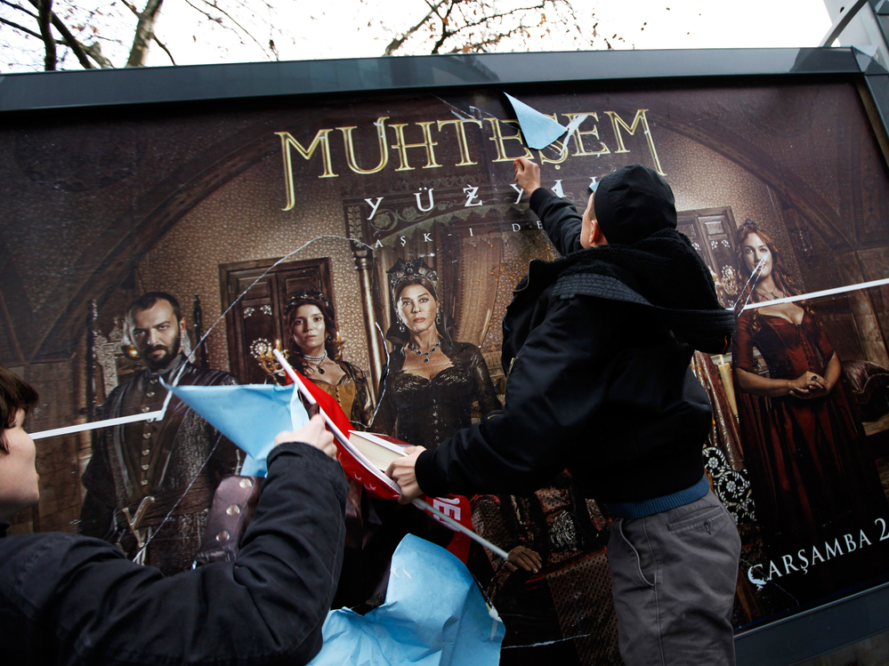 Demonstrators attack a billboard advertising the TV series The Magnificent Century during a protest in Istanbul on Jan. 9, 2011.