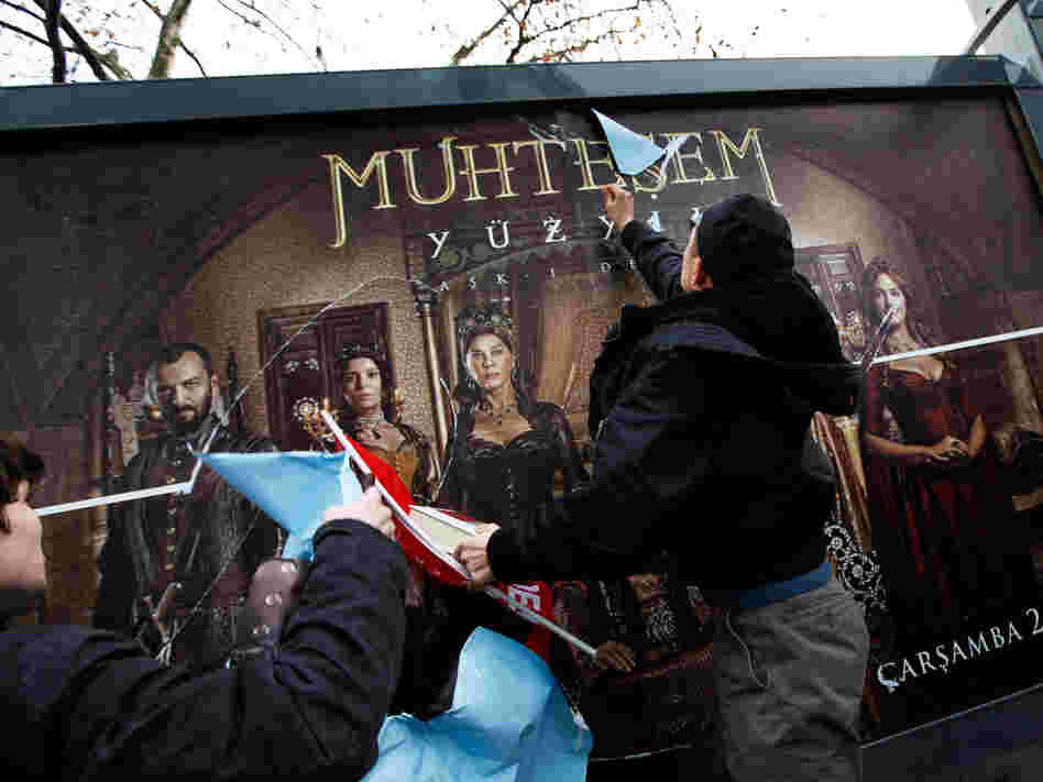 Demonstrators attack a billboard advertising the TV series The Magnificent Century during a protest in Istanbul on Jan. 9, 2011.