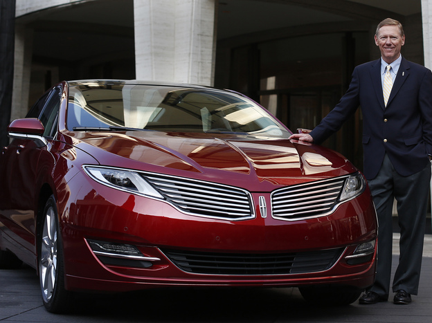 Alan Mulally, president and CEO of Ford Motor Co., stands next to the Lincoln MKZ. For the first time ever, Ford will promote the Lincoln brand during the Super Bowl.