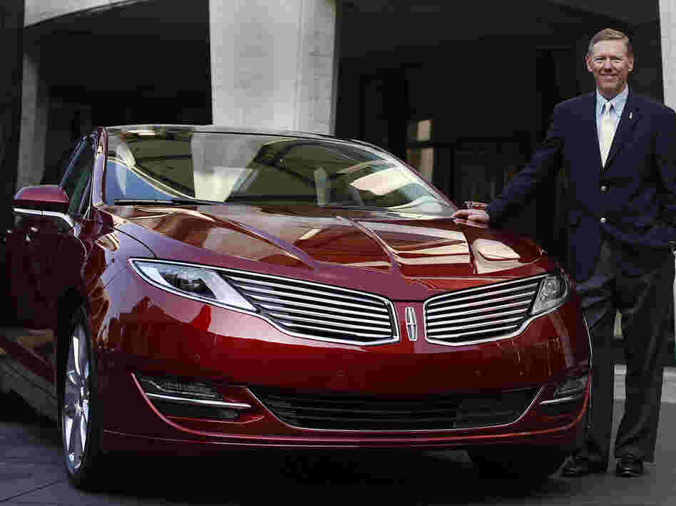 Alan Mulally, president and CEO of Ford Motor Co., stands next to the Lincoln MKZ. For the first time ever, Ford will promote the Lincoln brand during the Super Bowl.