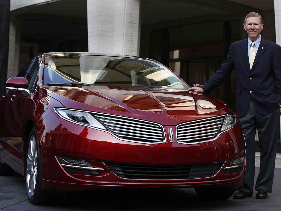 Alan Mulally, president and CEO of Ford Motor Co., stands next to the Lincoln MKZ. For the first time ever, Ford will promote the Lincoln brand during the Super Bowl.