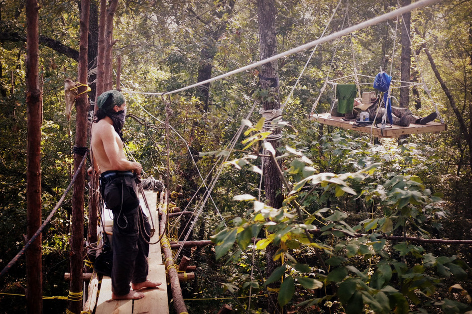 The protesters spent most of their time in the trees sleeping and reading.