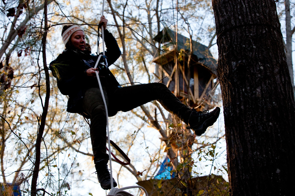 Grace Cagle, a 22-year-old protester, rappels down from the tree village. She spent a total of 17 days in the trees and was arrested once, and spent the night in jail.