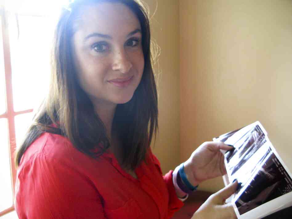 Maya Thompson holds a sonogram of her unborn daughter. After a period of hopelessness after her son's death, Thompson says you "either let this pain kill you or you let it make you stronger."