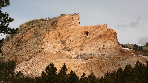 The Crazy Horse monument in March 2012. When finished, it is expected to be 641 feet long and 563 feet high. It is the largest mountain carving in progress.