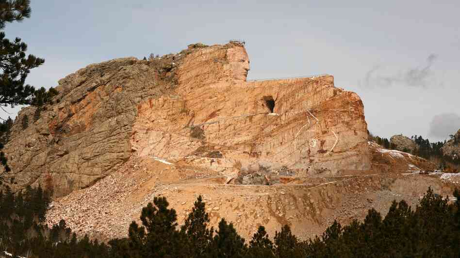The Crazy Horse monument in March 2012. When finished, it is expected to be 641 feet long and 563 feet high. It is the largest mountain carving in progress.