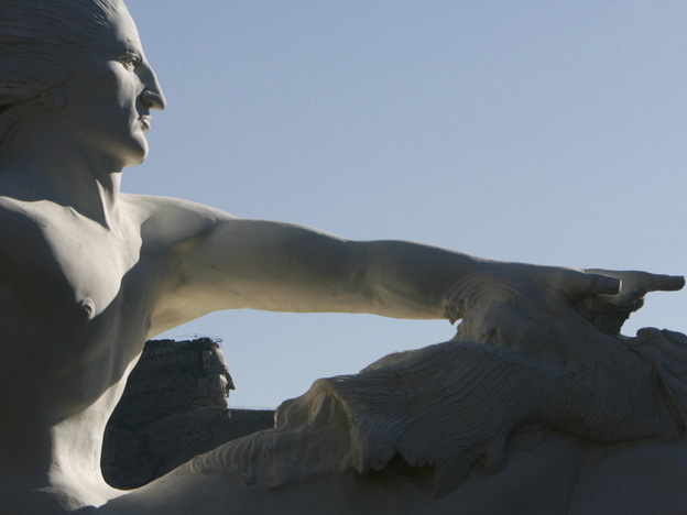 A 1/34th scale model of what the Crazy Horse sculpture will look like, foreground, frames the actual carving in 2006.