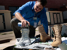 David Easterling, manager of the Suicide Prevention Program at Fort Riley in Kansas spray-paints Army boots white in 2009 as part of an on-base display to commemorate the six Fort Riley soldiers who committed suicide in 2008. David Easterling, manager of the Suicide Prevention Program at Fort Riley in Kansas spray-paints Army boots white in 2009 as part of an on-base display to commemorate the six Fort Riley soldiers who committed suicide in 2008.