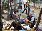 A member of Rio de Janeiro's Social Work Department speaks with crack addicts in a slum area known as "Crackland," during a police operation in the city in November. A member of Rio de Janeiro's Social Work Department speaks with crack addicts in a slum area known as "Crackland," during a police operation in the city in November.