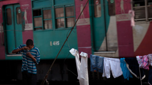 A man smokes crack near the Manguinhos slum in Rio de Janeiro in August.