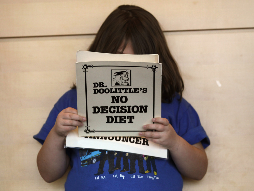 An overweight child reads her part during a skit that was in a 2010 program promoting healthy lifestyles sponsored by Children's Hospital near Denver. An overweight child reads her part during a skit that was in a 2010 program promoting healthy lifestyles sponsored by Children's Hospital near Denver.