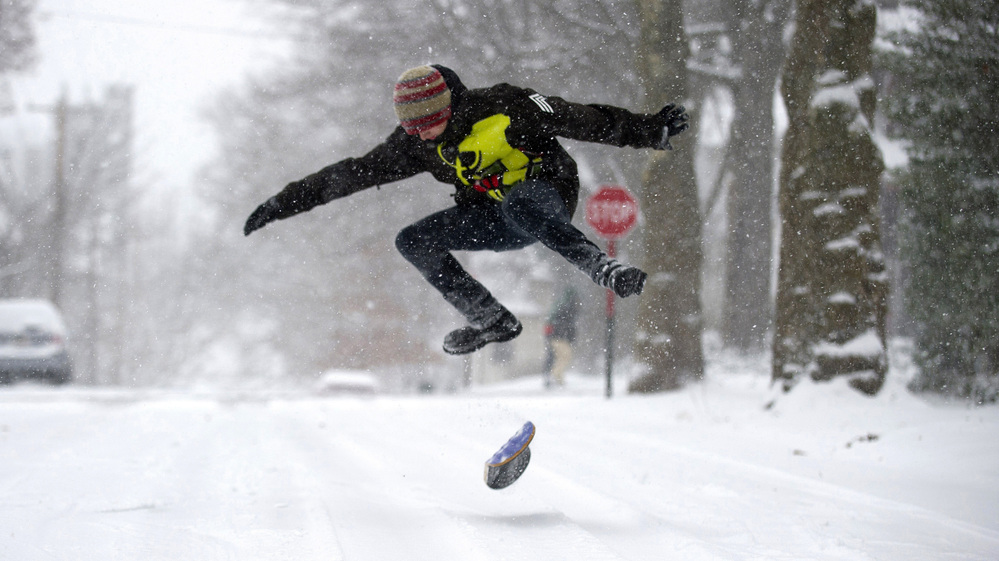 A large and powerful winter storm brought snow and ice to large sections of the Midwest and East Coast Wednesday. The weather made roads treacherous in many areas. But in Pittsburgh, Pa., Chandler Fescemeyer, 17, found a reason to break out a snowboard.