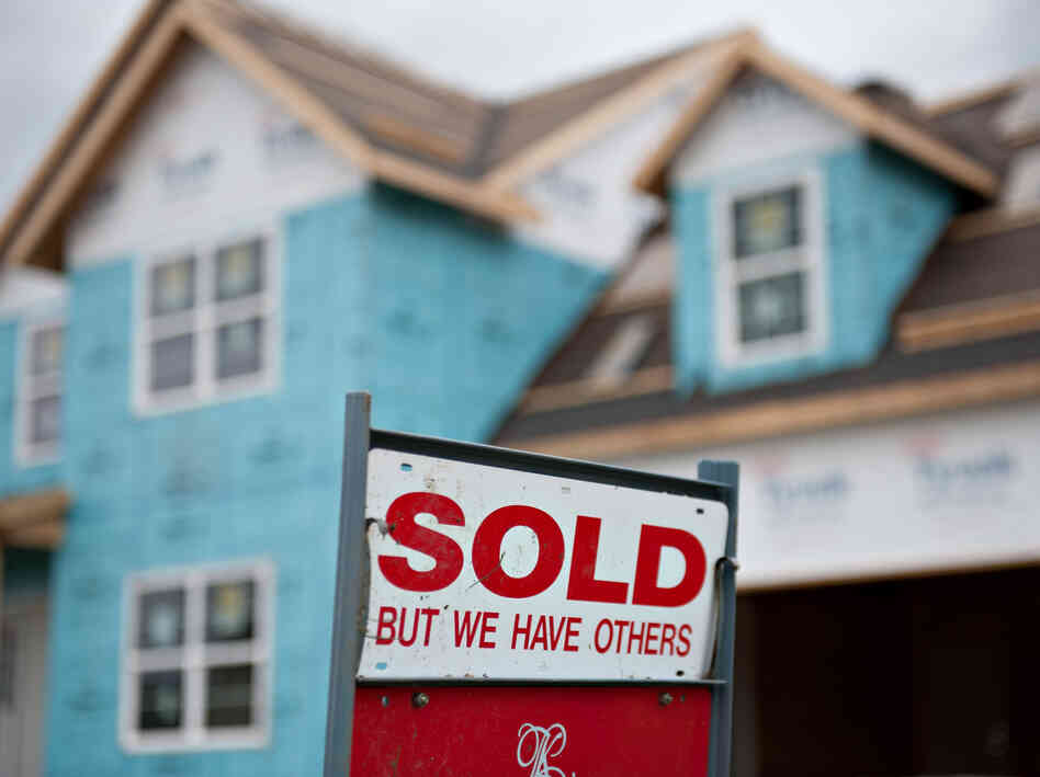 A "sold" sign outside a home under construction in Peoria, Ill., in October.