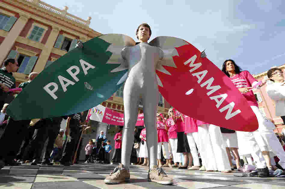 A man wears a costume reading "Dad" and "Mom" during a demonstration against gay marriage and adoption by same-sex couples in Nice, France, in October.