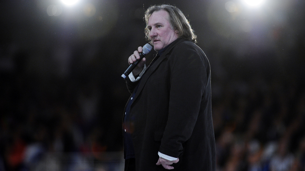 French actor Gerard Depardieu speaks outside Paris in March. He recently said he was moving to neighboring Belgium to avoid France's new top tax rate of 75 percent. The news ignited a debate in France over taxes and patriotism.