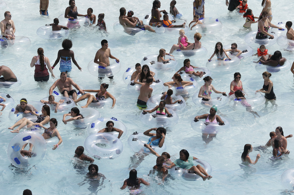 Swimmers try to keep cool in near-100-degree temperatures at Red Oaks Waterpark in Madison Heights, Mich., June 28.
