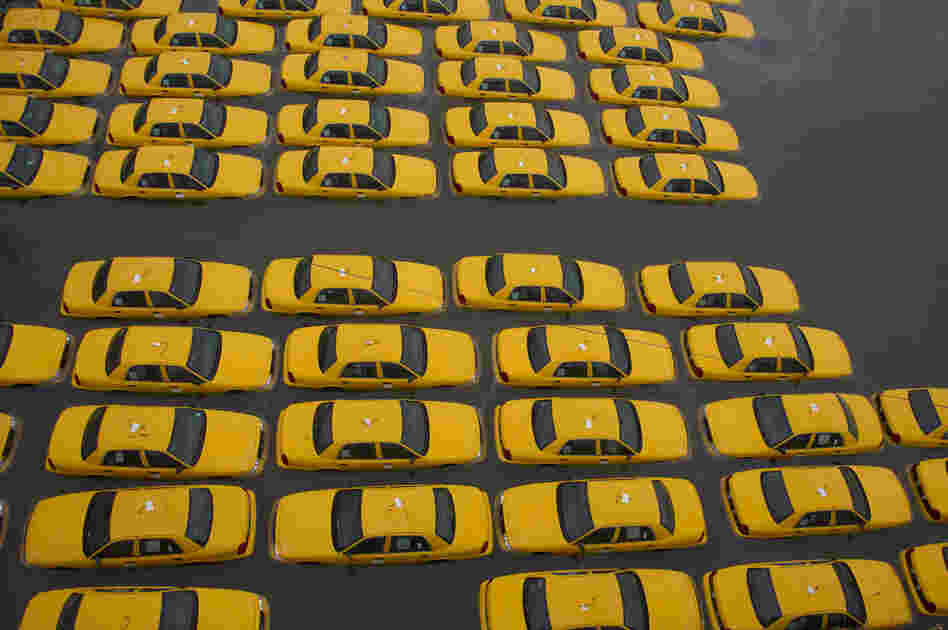 A parking lot full of yellow taxis is flooded as a result of Hurricane Sandy on Oct. 30 in Hoboken, N.J.