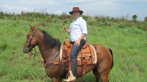 Abreu surveys the farm she owns in Tocantins state in north-central Brazil, on horseback.