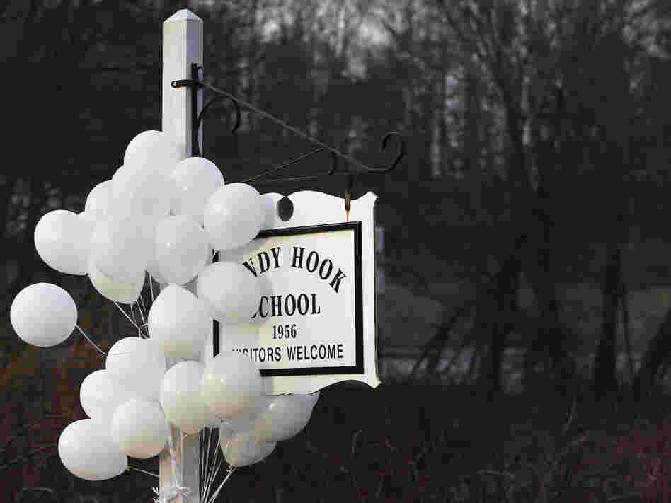 After the attack: Balloons hung from the Sandy Hook Elementary School sign on Dec. 15. On Dec. 14, six adults and 20 children were killed there before the gunman took his own life.