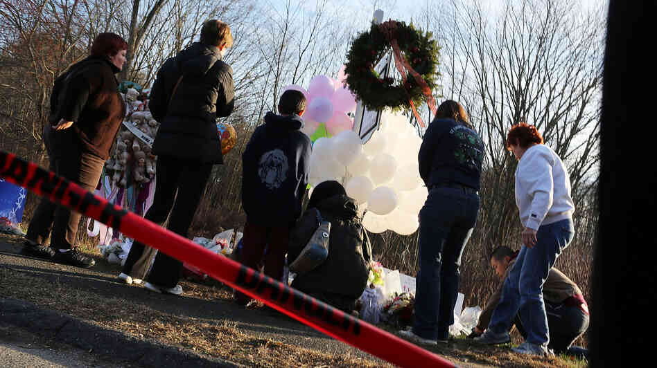 People visit a memorial outside Sandy Hook Elementary School in Newtown, Conn., on Dec. 15. People visit a memorial outside Sandy Hook Elementary School in Newtown, Conn., on Dec. 15.