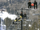 The Arizona Snowbowl resort began making snow exclusively with reclaimed wastewater this week. In this file photo, employees go up a ski lift at the resort. The Arizona Snowbowl resort began making snow exclusively with reclaimed wastewater this week. In this file photo, employees go up a ski lift at the resort.