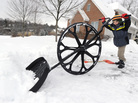 Nathan Lee, 5, was using a "wovel" to move snow from his family's driveway earlier today in State College Pa. Nathan Lee, 5, was using a "wovel" to move snow from his family's driveway earlier today in State College Pa.
