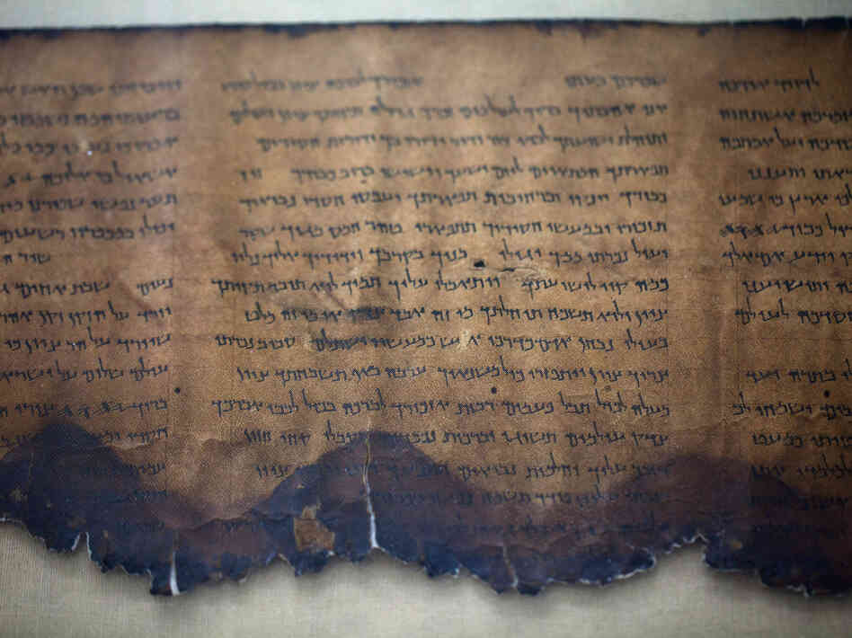A fragment of the 2,000-year-old Dead Sea Scrolls is laid out at a laboratory in Jerusalem. More than 60 years after their discovery, 5,000 images of the ancient scrolls are now online.
