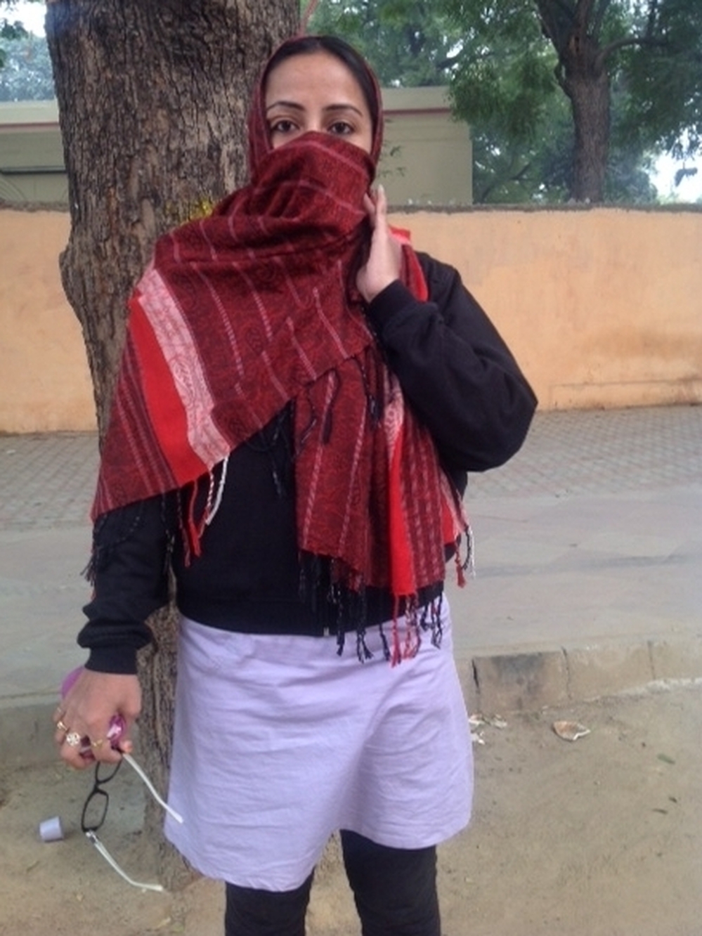 Nasreen Jahan, who was taking part in a protest, said that after her divorce, her husband attacked her with acid, disfiguring her face.