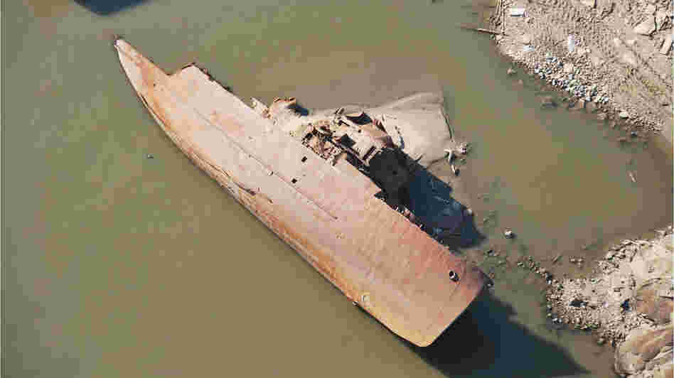 This WWII-era minesweeper once was a floating museum in St. Louis. Swept away in a 1993 flood, it has been under water in the river for most of the years since. But the ship has been exposed as the river's water level has fallen. (Photo taken on Dec. 14.) This WWII-era minesweeper once was a floating museum in St. Louis. Swept away in a 1993 flood, it has been under water in the river for most of the years since. But the ship has been exposed as the river's water level has fallen. (Photo taken on Dec. 14.)