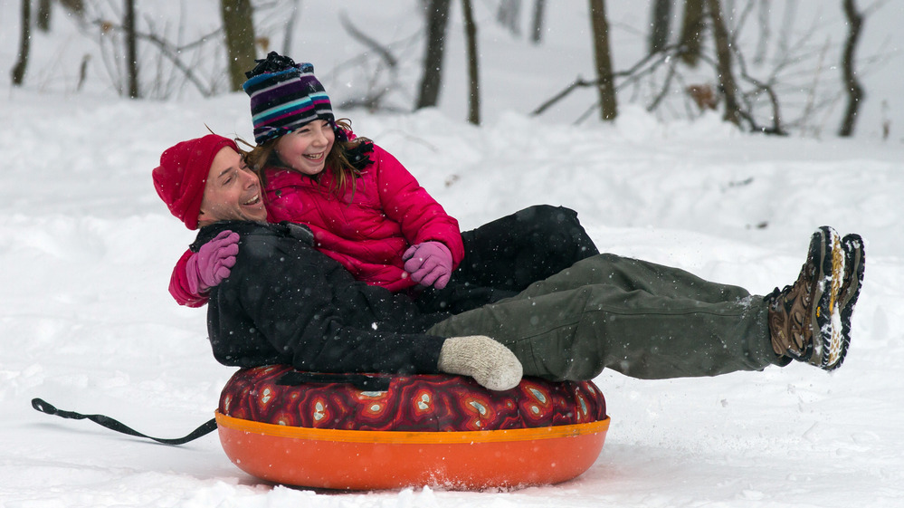 Eric Waite and his 8-year-old daughter Emerson went sliding Thursday in Greenfield, Mass.