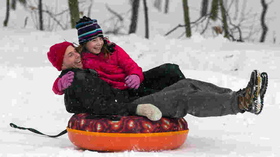 Eric Waite and his 8-year-old daughter Emerson went sliding Thursday in Greenfield, Mass.