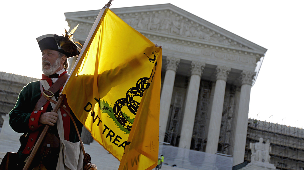 Tea Party supporter William Temple of Brunswick, Ga., protested outside the Supreme Court in June as justices debated the constitutionality of President Obama's health care law.