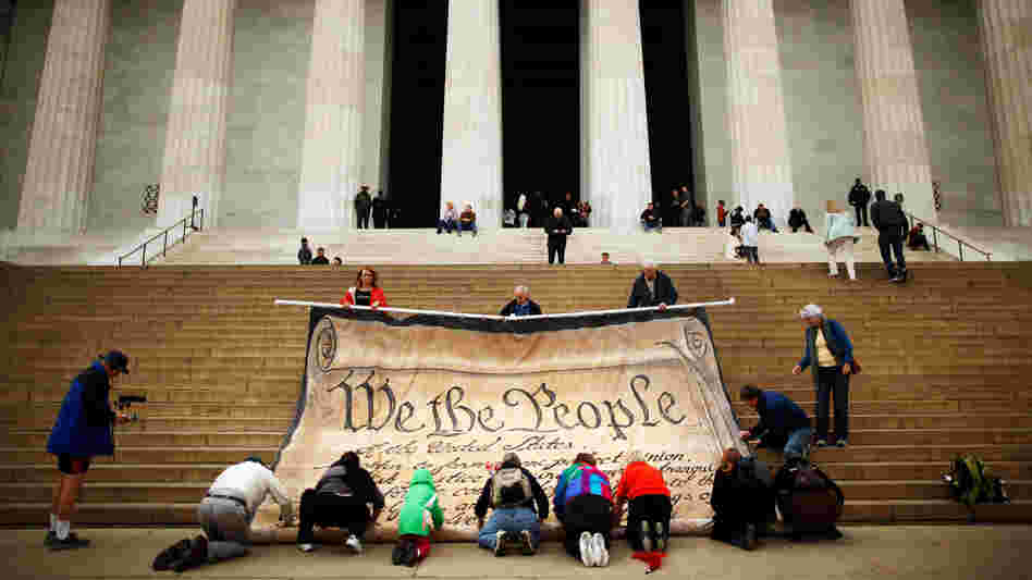 Opponents demonstrate against the Supreme Court's Citizens United ruling at the Lincoln Memorial in October. The decision changed campaigning, but it apparently didn't make ads more fact-based.