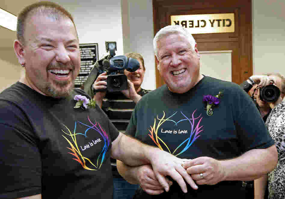 Steven Bridges (left) receives a wedding ring from Michael Snell, early Saturday at City Hall in Portland, Maine. Same-sex couples in Maine are now legally allowed to marry under a new law that went into effect at 12:01 a.m.