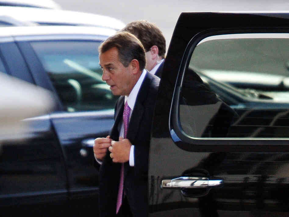 House Speaker John Boehner arrives at the White House on Friday for talks with President Obama and congressional leaders aimed at avoiding the "fiscal cliff."