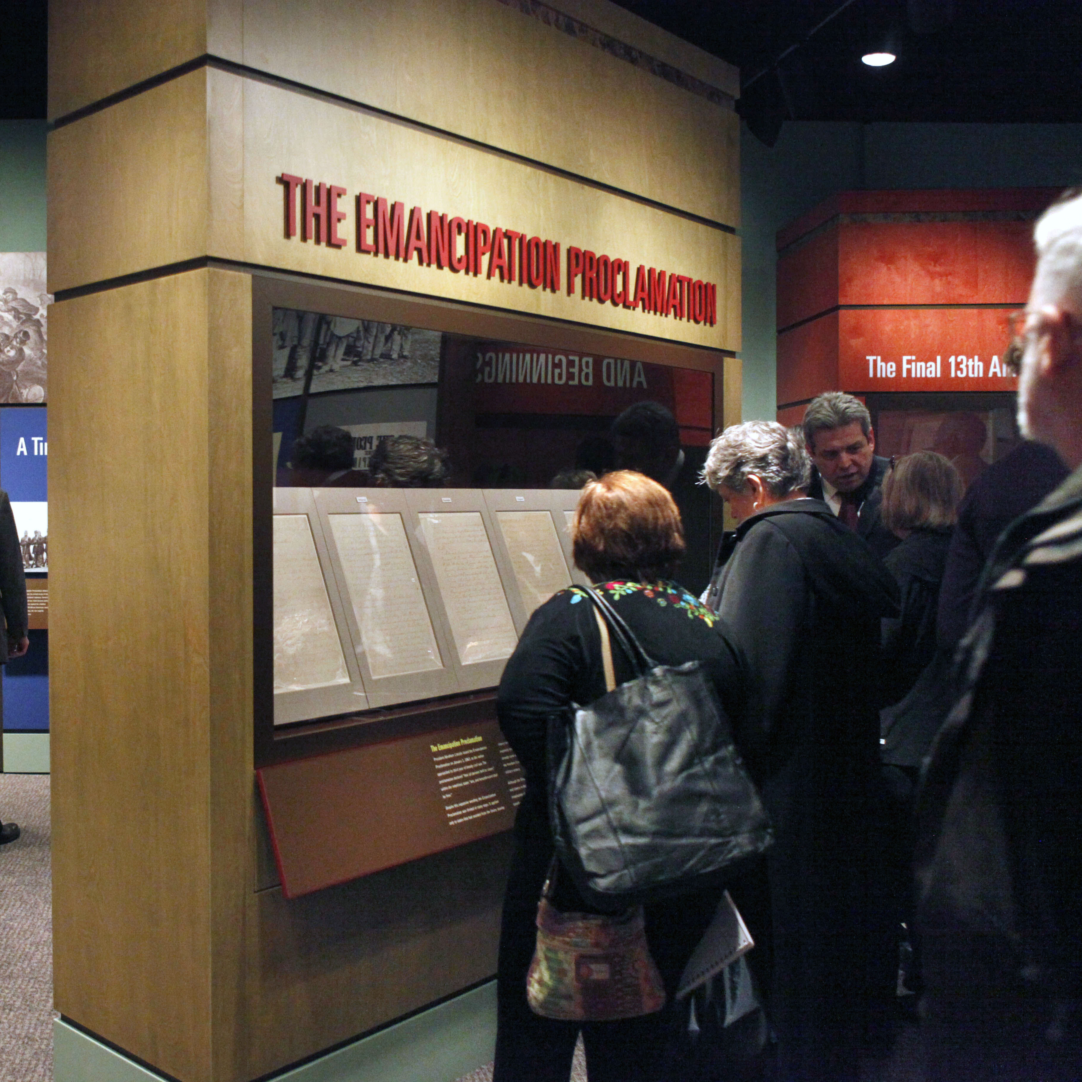People look at a display of the emancipation proclamation at the National Archives in Washington, Thursday, Nov. 4, 2010.
